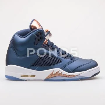 Photograph Nike Air Jordan 5 Retro blue and bronze sneaker 100372927