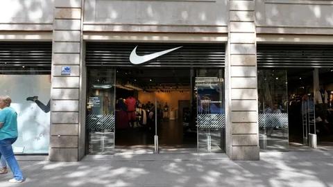 Nike logo and store front on La Rambla street in Barcelona Stock Footage