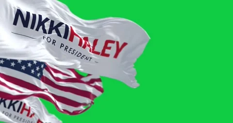 Nikki Haley and american flags waving isolated on green background Stock Footage 266630195