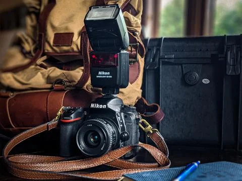 The nikon camera and case with the backpack Stock Photos
