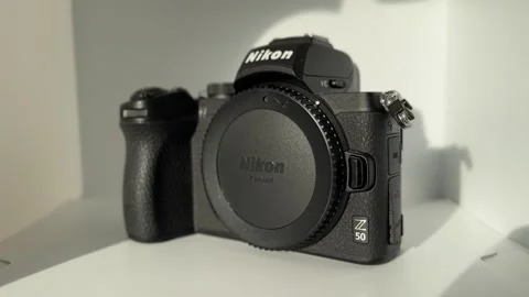 Nikon Z50 camera on white background Stock Footage 258736316