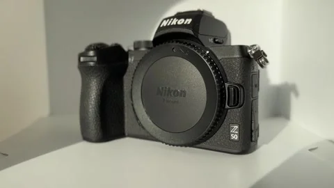 Nikon Z50 camera on white background Stock Footage 258745001