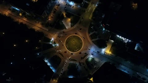Niksic Montenegro night traffic roundabout - drone shot Stock Footage