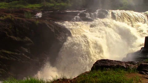 Nile River in Uganda flows through sheer rapids and forms raging waterfalls Stock Footage 106051031
