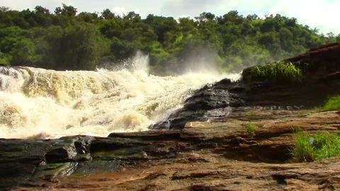 Nile River in Uganda flows through sheer rapids and forms raging waterfalls Stock Footage 106051364