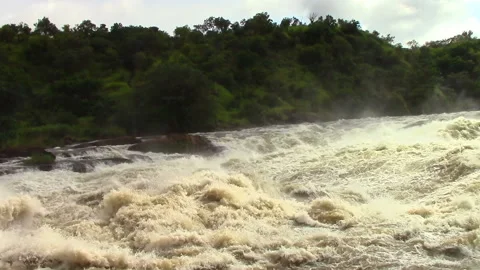 Nile River in Uganda flows through sheer rapids and forms raging waterfalls Stock Footage 106051538