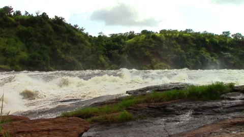 Nile River in Uganda flows through sheer rapids and forms raging waterfalls Stock Footage 106051753