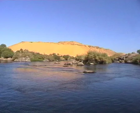 Nile River with view of Sahara sand dunes in distance Stock Footage 22672853