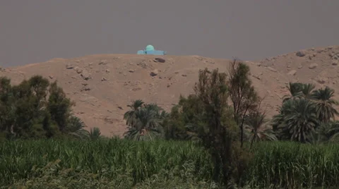 Nile shores with trees and a small blue mosque, Egypt Stock Footage 35018559