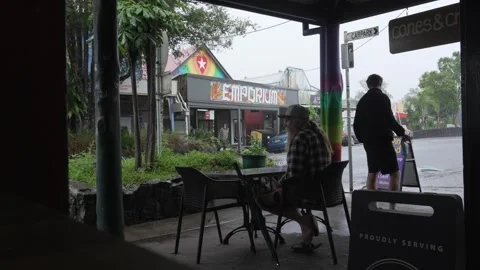 Nimbin, Australia - 10/23/2024: Inside coffee shop while raining outside Stock Footage 289625901
