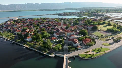 Nin, Croatia - 4K Flying around of the historic town and small island of Nin Stock Footage 220172289