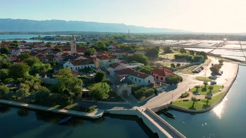 Nin, Croatia - 4K flying sideways by the historic town and small island of Nin Stock Footage 219027504