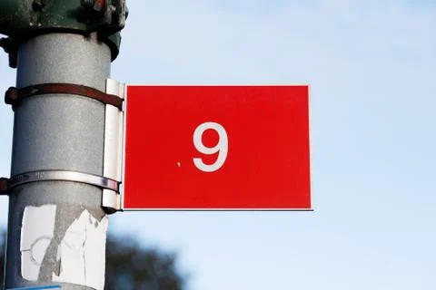 The nine digit with white text on red plate Stock Photos