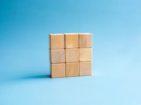 Nine empty simple wooden puzzles stacking arranging compleated isolated on .. Stock Photos
