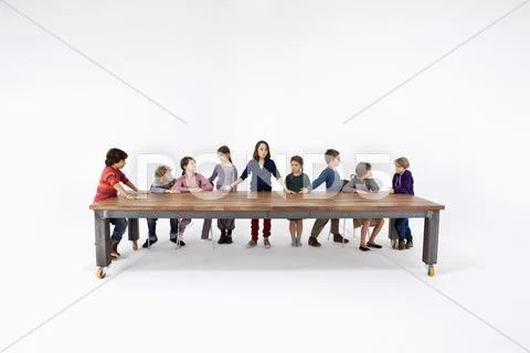 Nine kids arranged to imitate Leonardo Da Vinci's The Last Supper Stock Photos