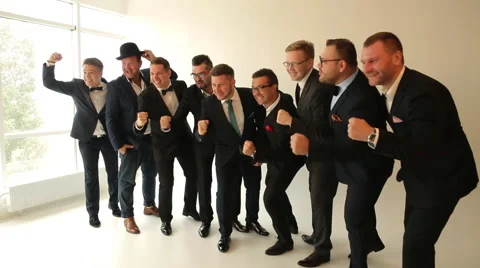 Nine men in suits posing for the camera Stock Footage 62337020