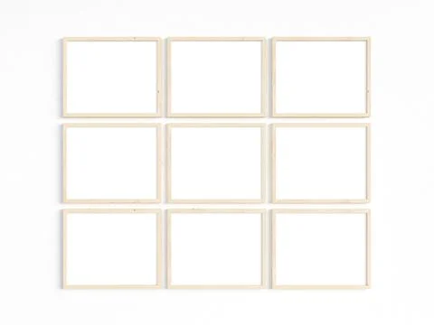 Nine thin wooden frames on a light wall. Stock Photos