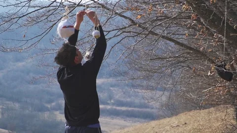 Ninja Preparing Training Targets in a Rural Outdoor Setting Stock Footage 307847628