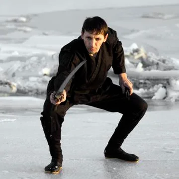 Ninja with sword on ice Stock Photos