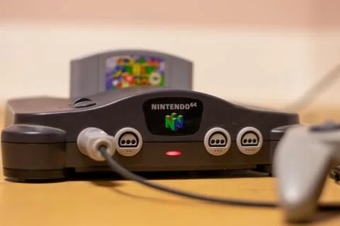 A Nintendo 64 Console Turned On With Super Mario 64 in the Cartridge Slot Stock Photos