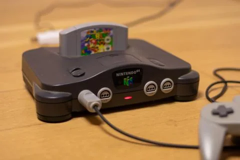 A Nintendo 64 Console Turned On With Super Mario 64 in the Cartridge Slot Stock Photos