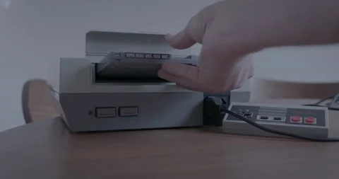 Nintendo Entertainment System is turned on with Controller and Game Cartridge Stock Footage 153817980