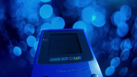 Nintendo Game Boy Color Grape (Blue), Vintage handheld game console - Editorial Stock Footage 217627969