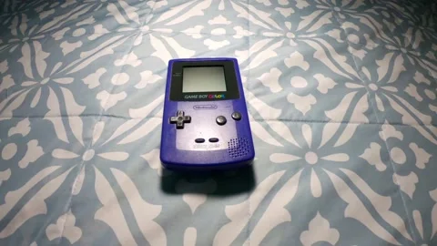 Nintendo Game Boy Console Grape model, Vintage handheld game console - Editorial Stock Footage 217627971