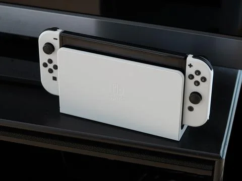 Nintendo Switch  OLED Model in handheld mode. Popular mobile gaming console Stock Photos
