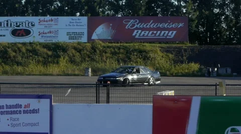 Nissan Maxima spins out while drifting around corner at drift event. 스톡 동영상 59747340
