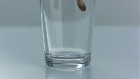 Nitro Cold Brew Coffee Pours Into Bottom of Clear Glass in Slow Motion Stock Footage 75110016
