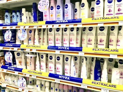 Nivea Lotion, A row of display cases for beauty care products, with the brand “N Stock Photos