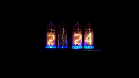 Nixie tube digital display changes from 2:23 to 2:24. Stock Footage 278438831