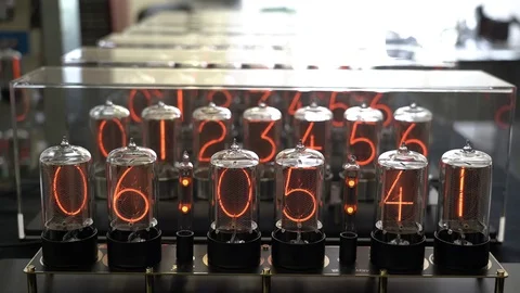 Nixie tube retro electronic clock numbers, cold cathode display, glow discharge Stock Footage 105262409