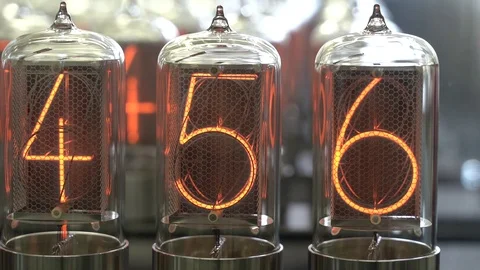 Nixie tube retro electronic clock numbers, cold cathode display, glow discharge Stock Footage 105262611