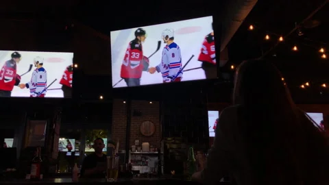 NJ Devils Beat NY Rangers in Game 7 Playoffs Seen on Sports Bar Tv's Stock Footage 240575605