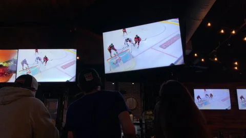 NJ Devils Beat NY Rangers in Game 7 Playoffs Seen on Sports Bar Tv's Stock Footage 240576131