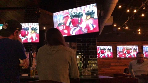NJ Devils Beat NY Rangers in Game 7 Playoffs Seen on Sports Bar Tv's Stock Footage 240576679