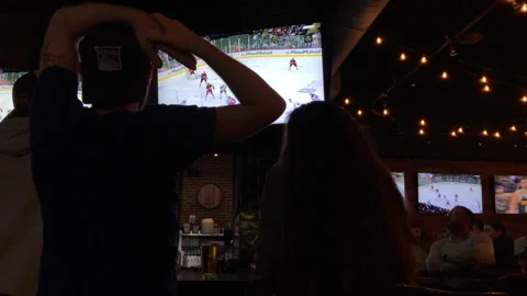 NJ Devils Beat NY Rangers in Game 7 Playoffs Seen on Sports Bar Tv's Stock Footage 240579083