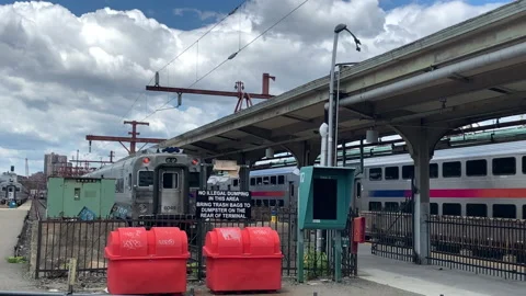 NJ Transit Train waiting for passengers at Tracks of the Hoboken NJ Terminal Video stock 133465546