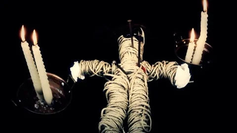 NM Voodoo doll candles hammer nails heart Stock Footage 83465292