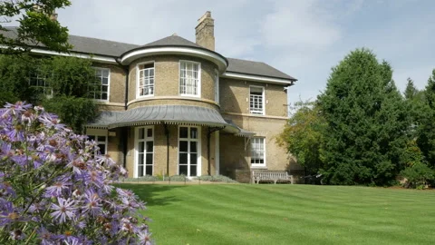 No 1 Brookside, the administrative offices within the Cambridge Botanic Gardens Stock Footage 155656139