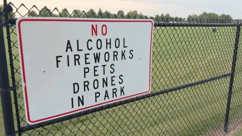 No alcohol fireworks pets drones in park sign 4k Stockbeeldmateriaal 342777911