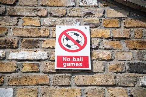 No Ball Games sign mounted on a brick wall Stock Photos