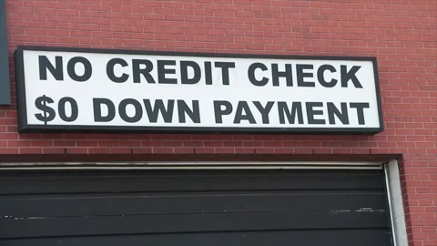 No credit check 0 zero dollar down payment sign outside on wall above garage Stock Footage 249102262