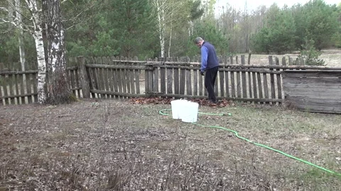 No-dig garden bed preparation. Man tamping down with his feet compost made .. Video stock 343717934