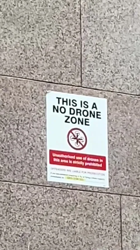 No Drone Zone Sign on Wall 4K Vertical Video 스톡 동영상 335018945