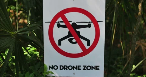 No Drone Zone warning sign in greenery outdoors Stock Footage 152488857