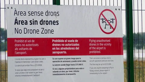 No drone zone warning sign at Valencia Airport perimeter gate Stock Footage 344972076