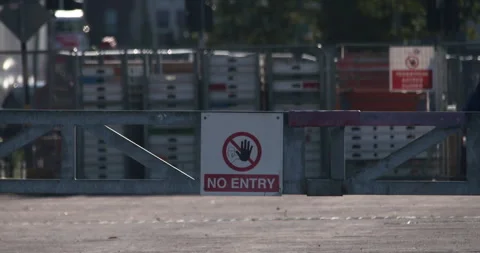 No Entry warning information sign on metal barrier blocking site entrance Stock Footage 341770944